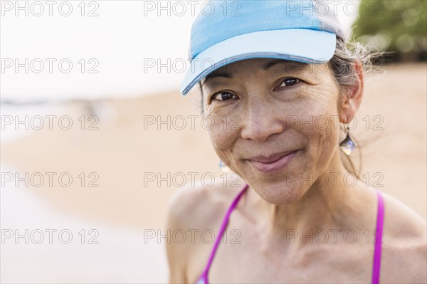 Japanese woman smiling on beach