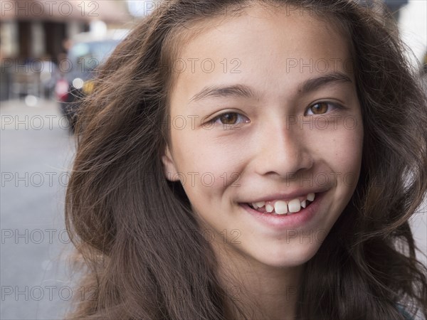 Close up of mixed race girl smiling