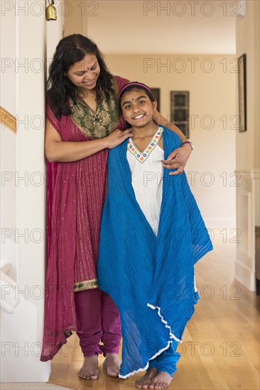 Indian mother and daughter wearing traditional dresses