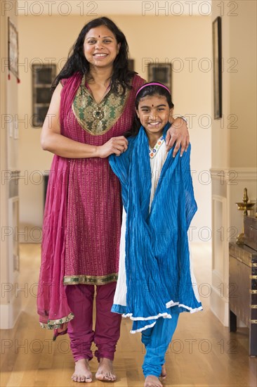 Indian mother and daughter wearing traditional dresses
