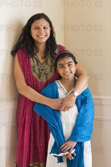 Indian mother and daughter wearing traditional dresses