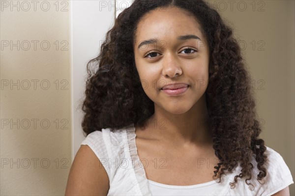 Mixed race teenage girl smiling