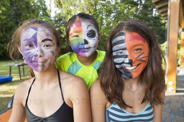 Smiling girls wearing face paint