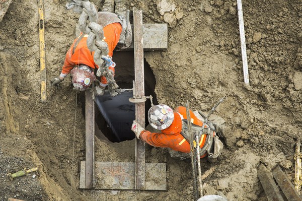 Caucasian workers building at construction site