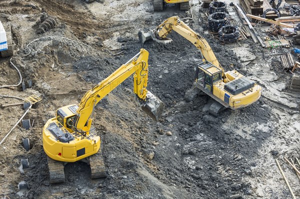 Aerial view of diggers at construction site