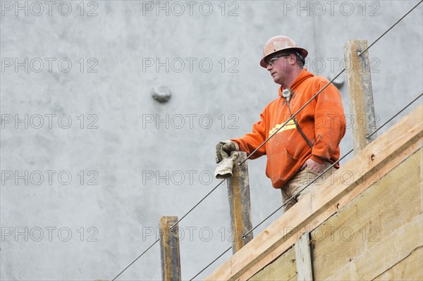 Caucasian worker standing at construction site