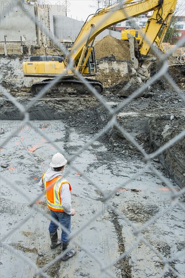 Caucasian worker standing at construction site