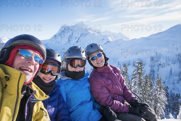 Family riding ski lift