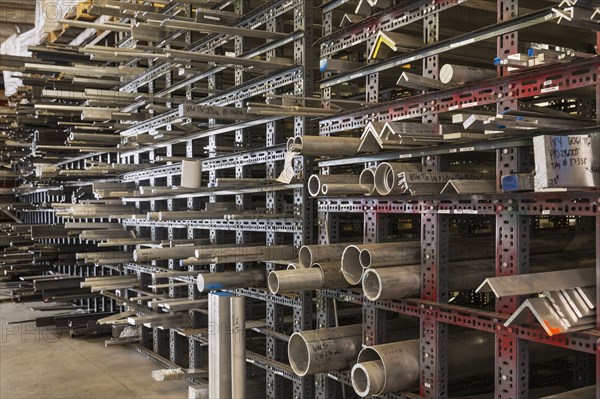 Metal parts on racks in warehouse