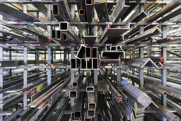 Metal parts on racks in warehouse