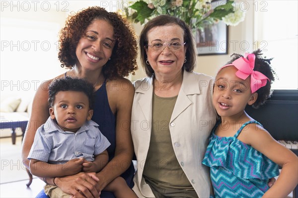 Portrait of smiling mixed race multi-generation family