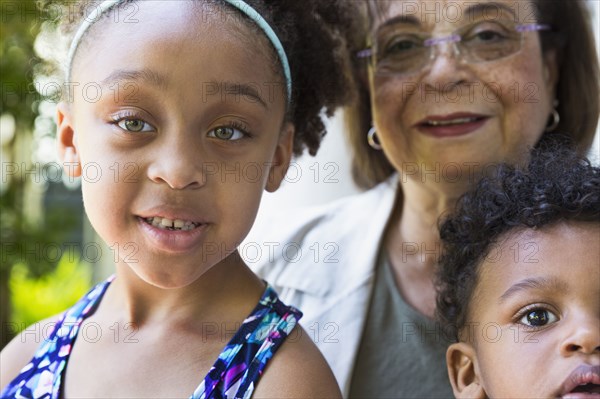 Close up of mixed race brother and sister with grandmother