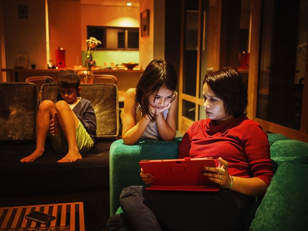 Family relaxing together in living room