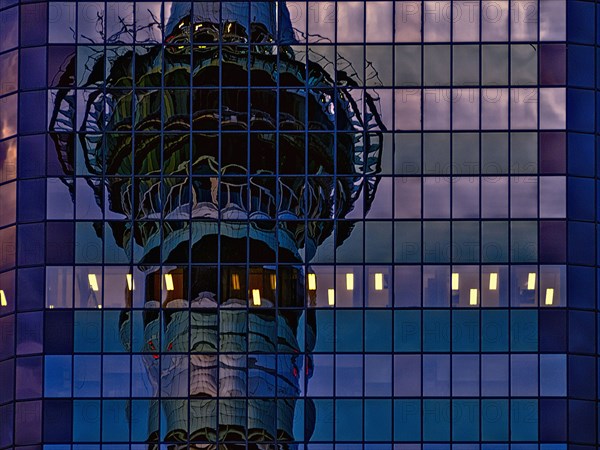 Skytower reflected in skyscraper windows
