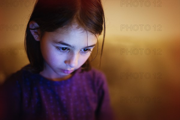 Mixed race girl looking down