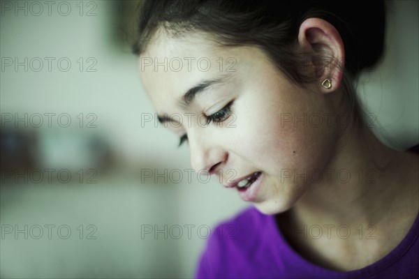 Mixed race girl looking down