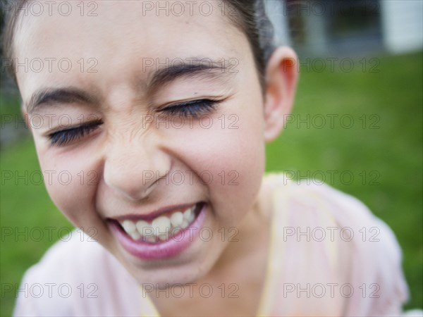 Close up of mixed race girl laughing