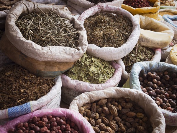 Sacks of dried spices for sale in market