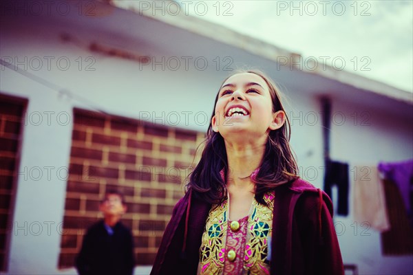 Girl looking up and laughing