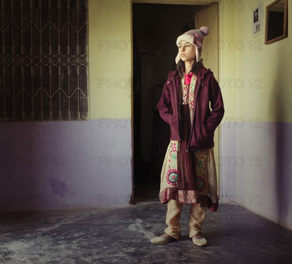 Mixed race girl wearing traditional clothing