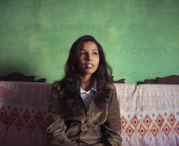 Woman smiling on sofa