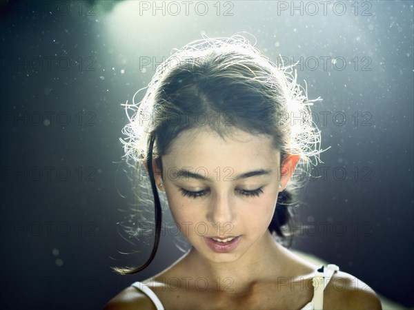 Close up of mixed race girl looking down