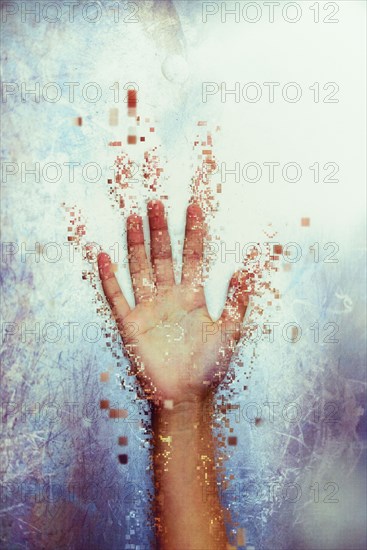 Pixelated hand dissolving