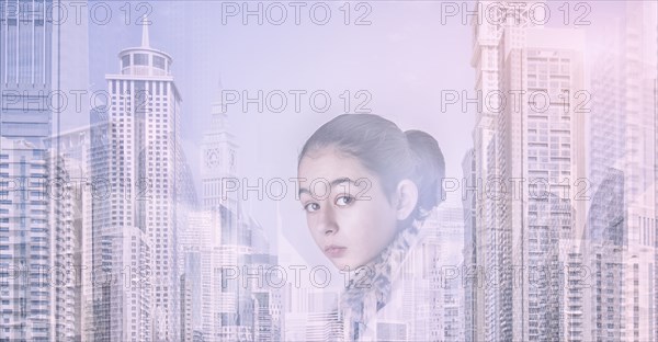 Mixed race girl over city skyline