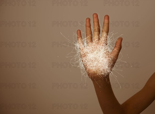 Hand of mixed race girl with graphic pattern