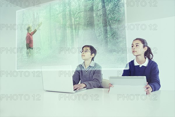 Children watching floating screen in online class