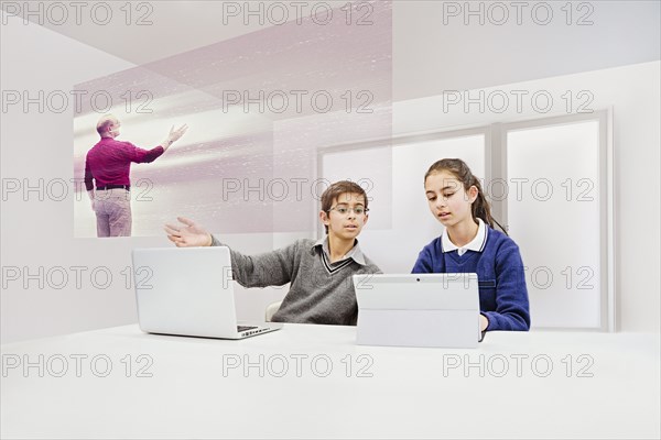 Children watching floating screen in online class