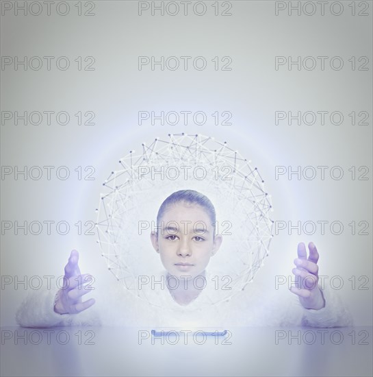 Mixed race girl holding sphere from digital tablet