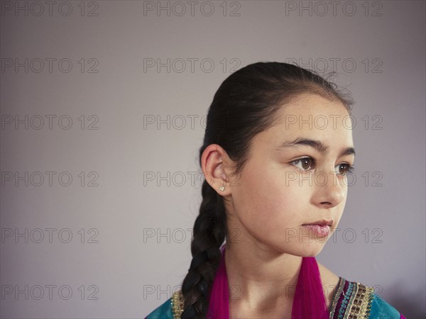 Close up of serious mixed race girl