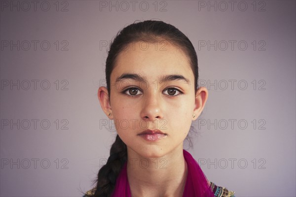 Close up of serious mixed race girl