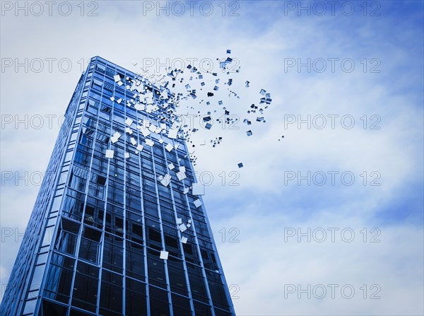 Pixelated highrise building and cloudy sky