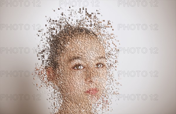 Pixelated mixed race girl with serious expression