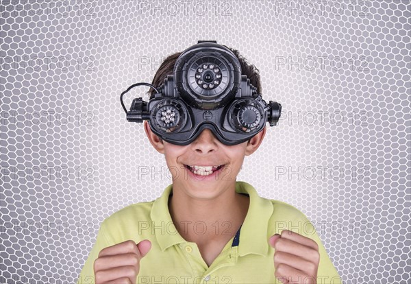 Mixed race boy wearing virtual reality goggles