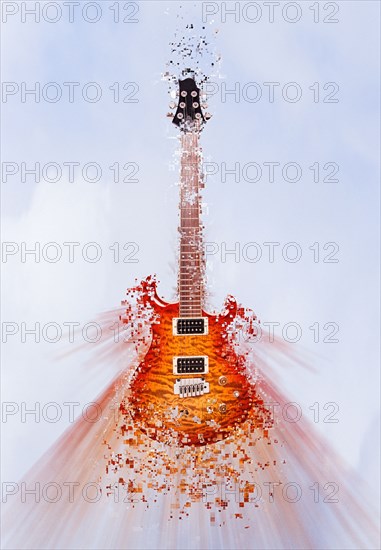 Pixelated guitar floating in sky