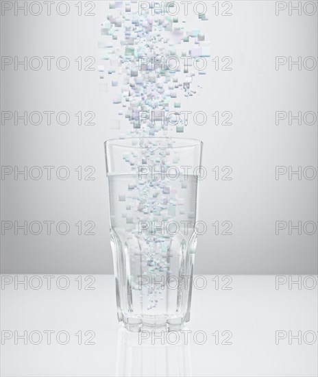 Blocks raining into water glass