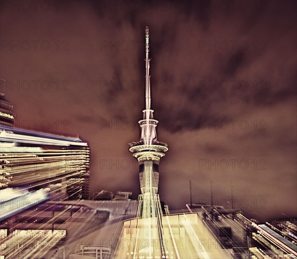 Double exposure of cityscape and cloudy sky