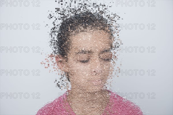 Mixed race boy with pixelated face