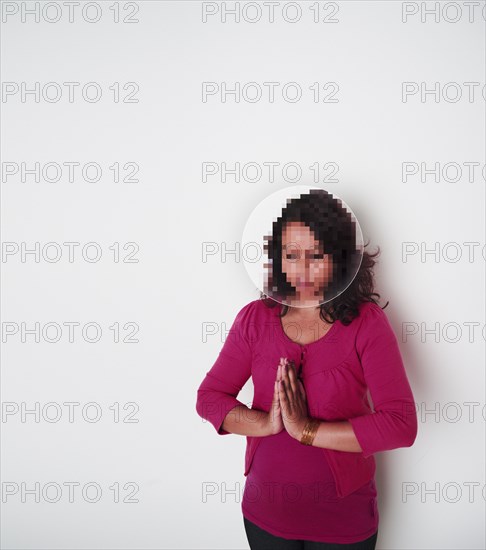 Mixed race woman with pixelated face