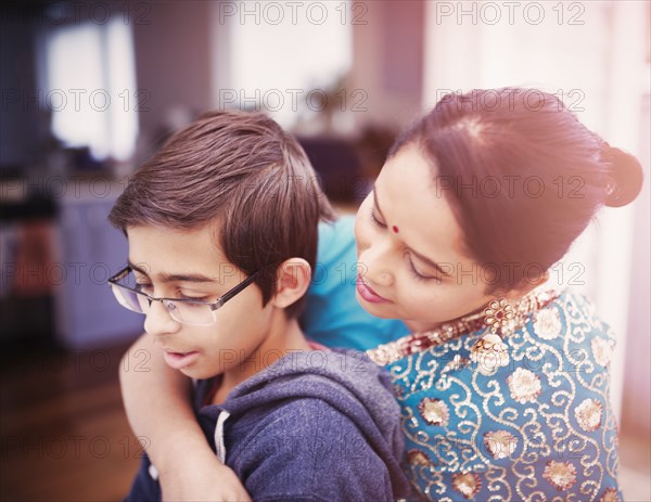 Mother hugging son