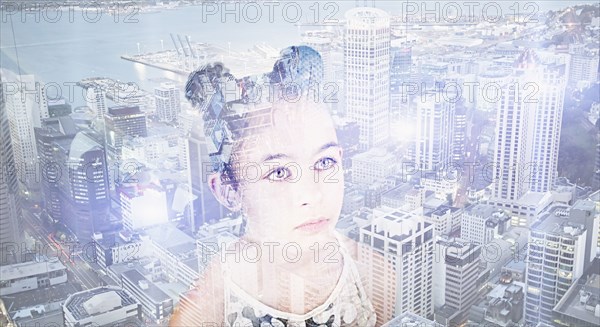 Double exposure of Mixed Race girl over urban waterfront