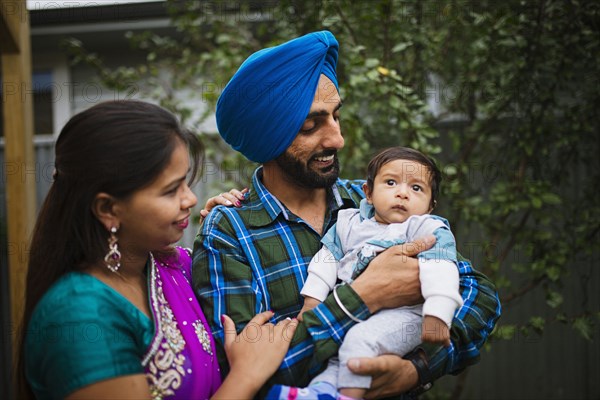 Couple admiring baby son