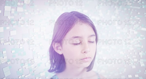 Pixels hovering near face of Mixed Race girl