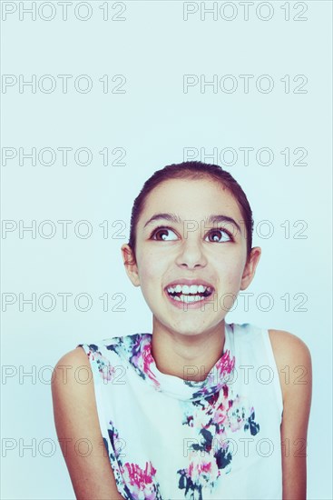 Portrait of smiling Mixed Race girl with big eyes