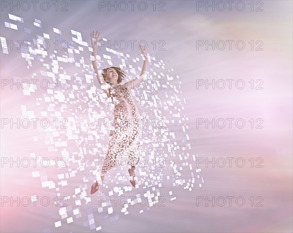 Mixed Race girl floating in pixels