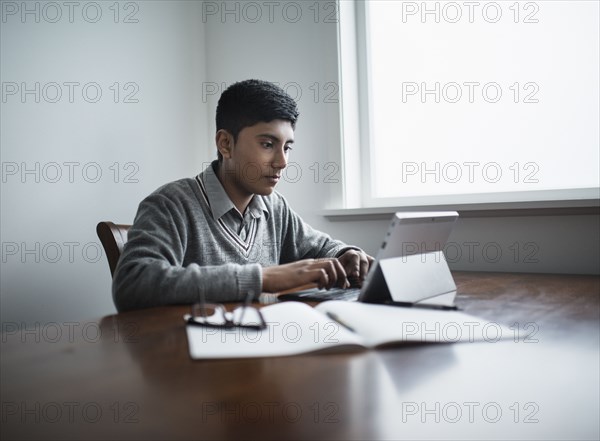 Fiji Indian boy using digital tablet