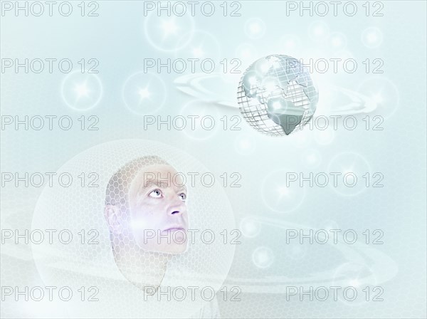 Caucasian man looking at globe in cyberspace